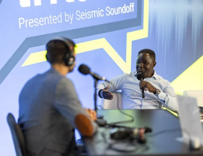 Photo of podcast participants recording an episode