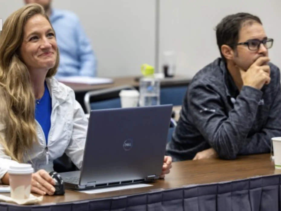 Photo of adult geophysicists in a classroom environment learning from instructor